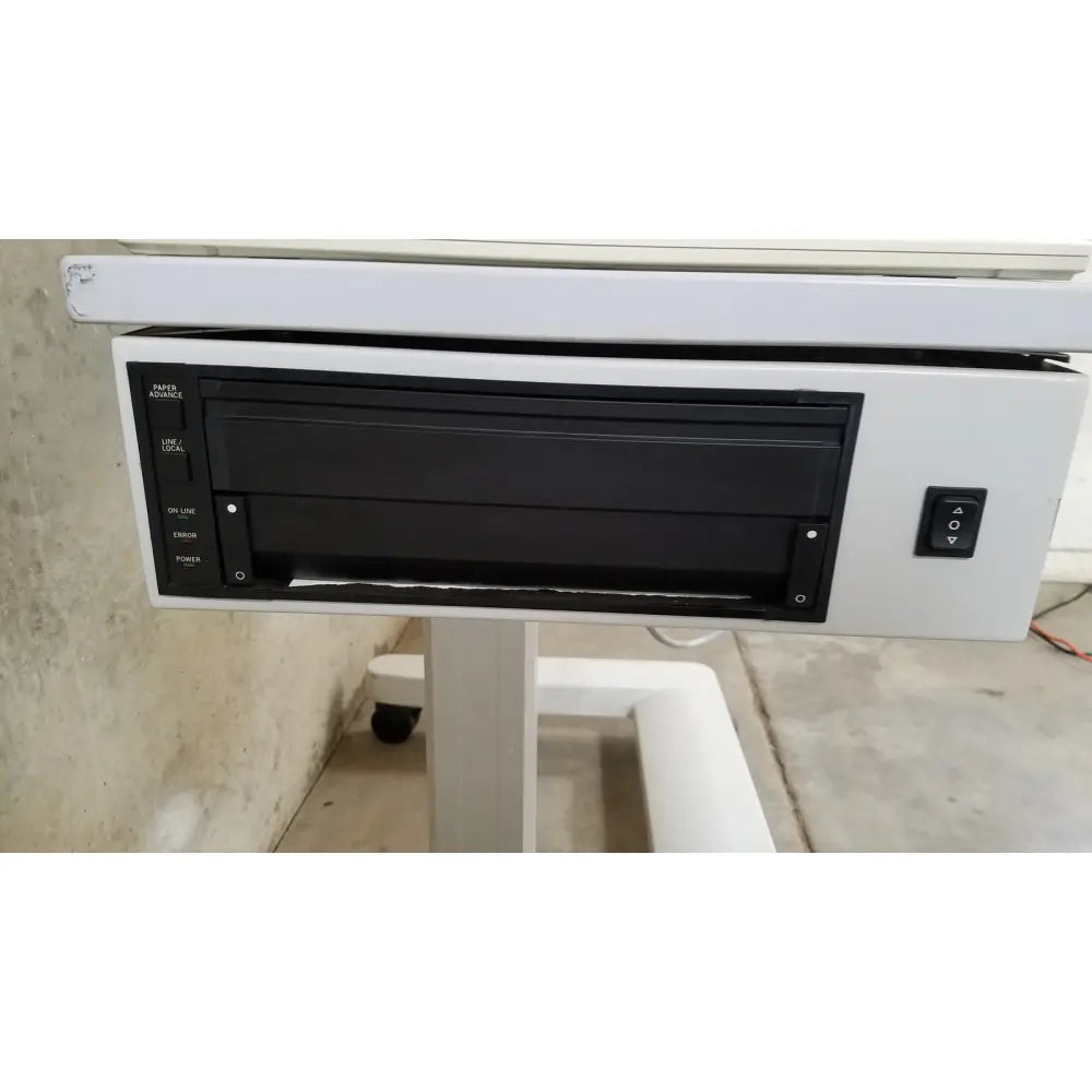 White Zeiss Humphrey visual field analyzer model 740 with black paper tray and control panel for eye examinations