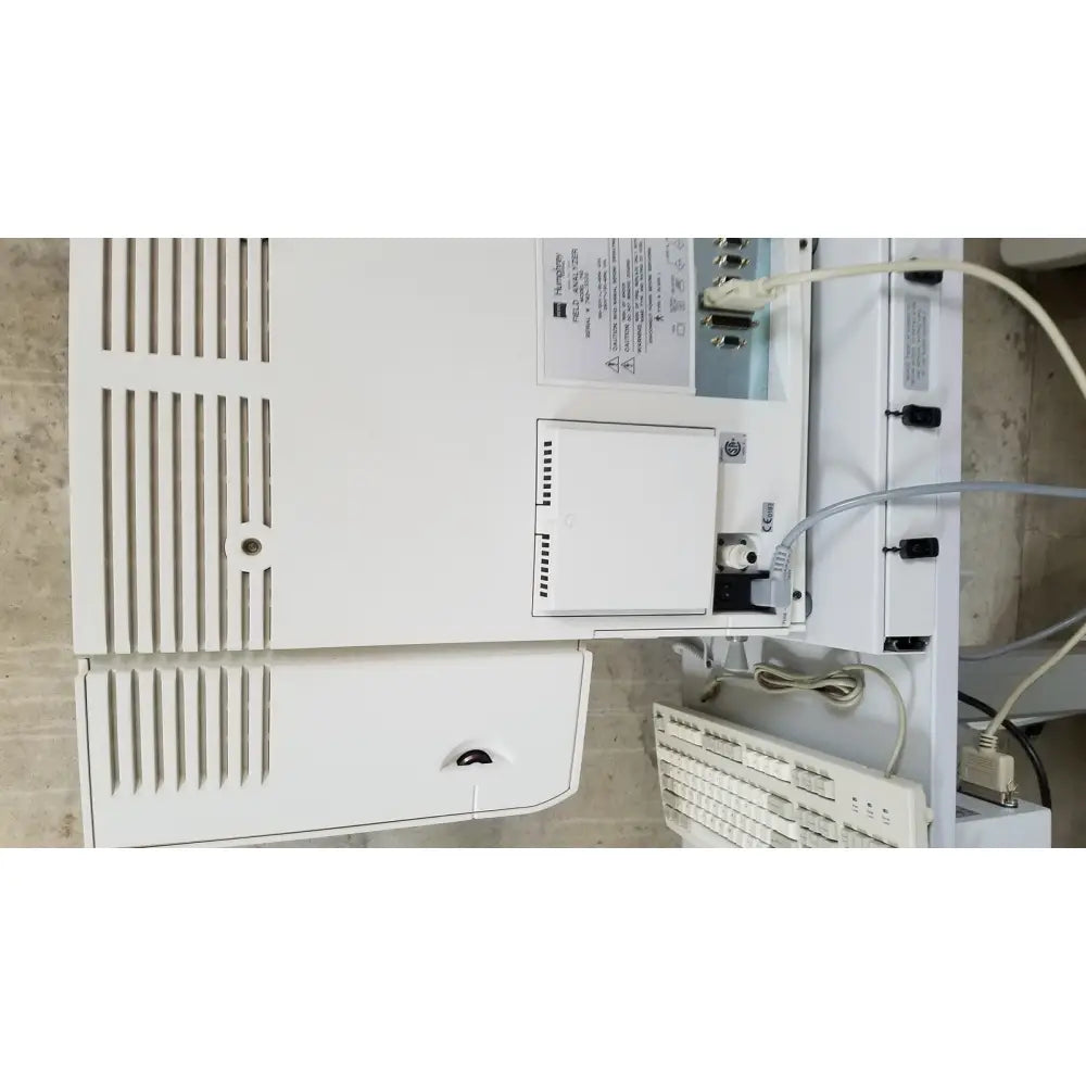 White plastic Zeiss Humphrey visual field analyzer model 740 printer with vertical vents and front compartment panel