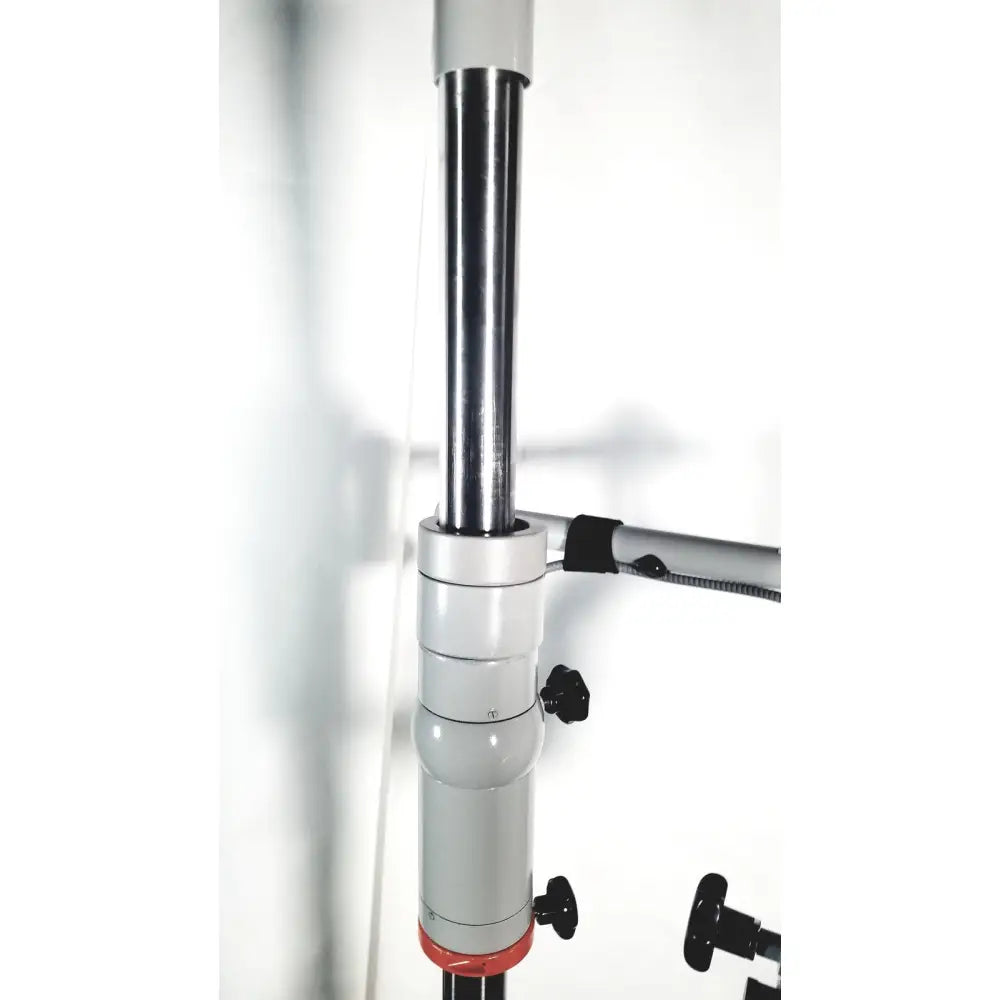 Silver and black adjustable tripod leg with red accent at base on zeiss opmi-1 prescotts mark ii floor stand