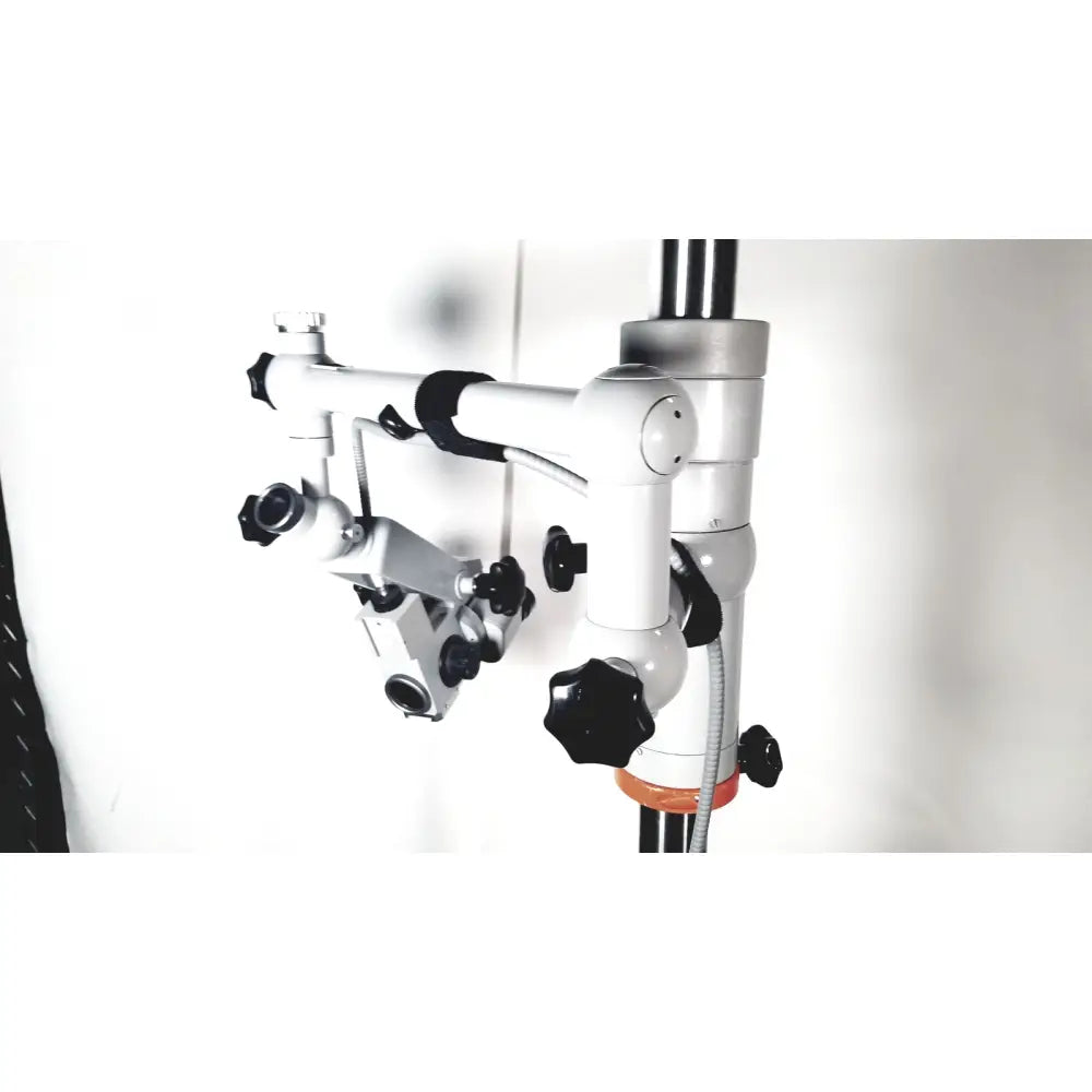 Silver and black zeiss opmi-1 prescott’s mark ii dental operating microscope with adjustable arms and floor stand