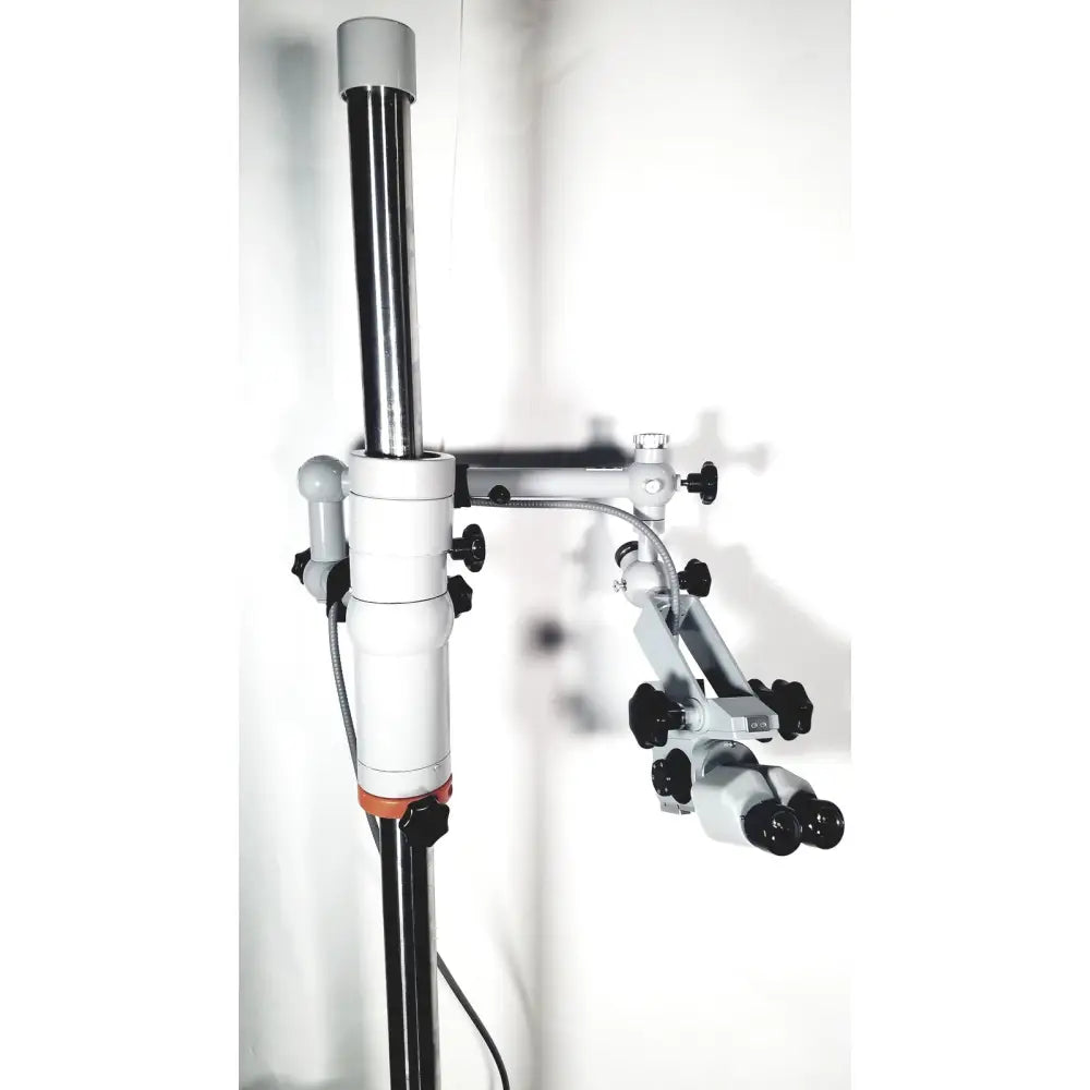 Silver and black zeiss opmi-1 prescotts mark ii surgical microscope with adjustable arms and floor stand tripod