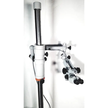 Silver and black zeiss opmi-1 prescotts mark ii surgical microscope with adjustable arms and floor stand tripod