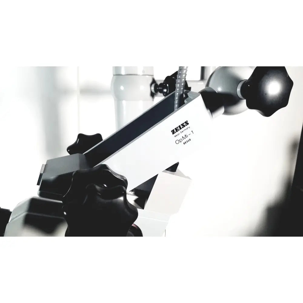 White and black zeiss opmi-1 prescotts mark ii optical microscope with matte metal components and floor stand