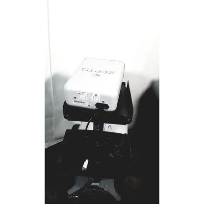 White zepto precision pulse projector mounted on a black adjustable stand with zepto power console for capsulotomy