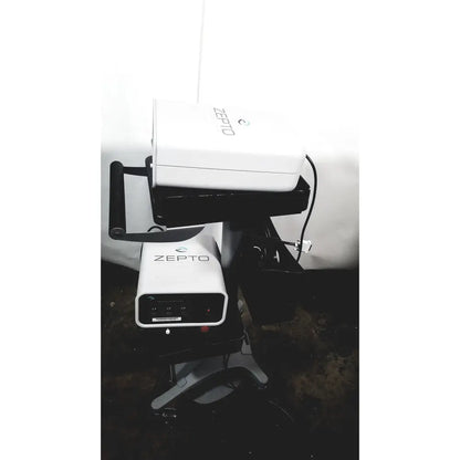 White zepto precision pulse capsulotomy device with sleek rectangular design and black accent zepto power console base