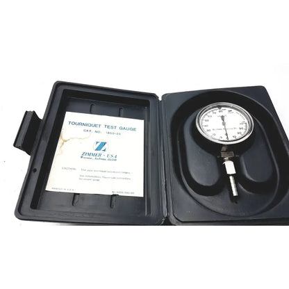Zimmer 1550-20 tourniquet test gauge mmhg with white face black markings in a black plastic case for tourniquet test use
