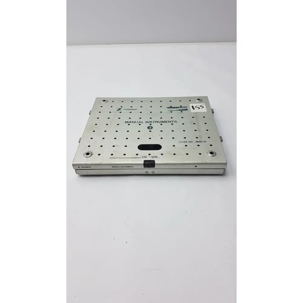 Silver metallic Zimmer 2800-95 fracture management manual instruments sterilization case with grid holes labeled manual instruments