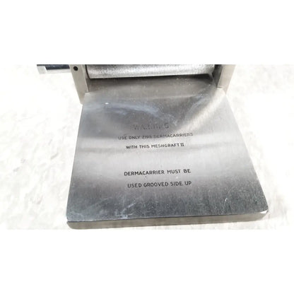 Silver metallic meshgraft dermatome ii 2195-100 with engraved instructions for use and skin graft blades
