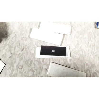 Black rectangular electronic component with white center on white sheet for zimmer meshgraft dermatome ii 2195-100 skin graft blades