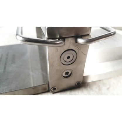 Stainless steel zimmer meshgraft dermatome ii 2195-100 clamp with sturdy handle and engraved circular markings