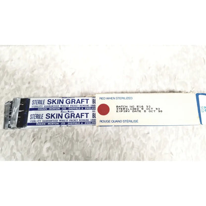 Sterile skin graft package of zimmer meshgraft dermatome ii 2195-100 with white blue labeling and red sterilization indicator