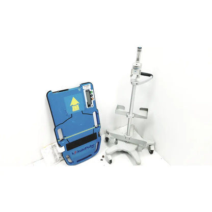 Blue autopulse defibrillator pad with yellow warning symbol and digital display on zoll autopulse resuscitation system