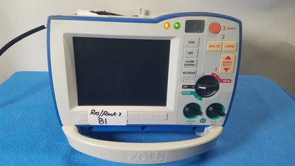 Blue and white zoll r series als patient monitor with digital screen control buttons and surepower battery pack