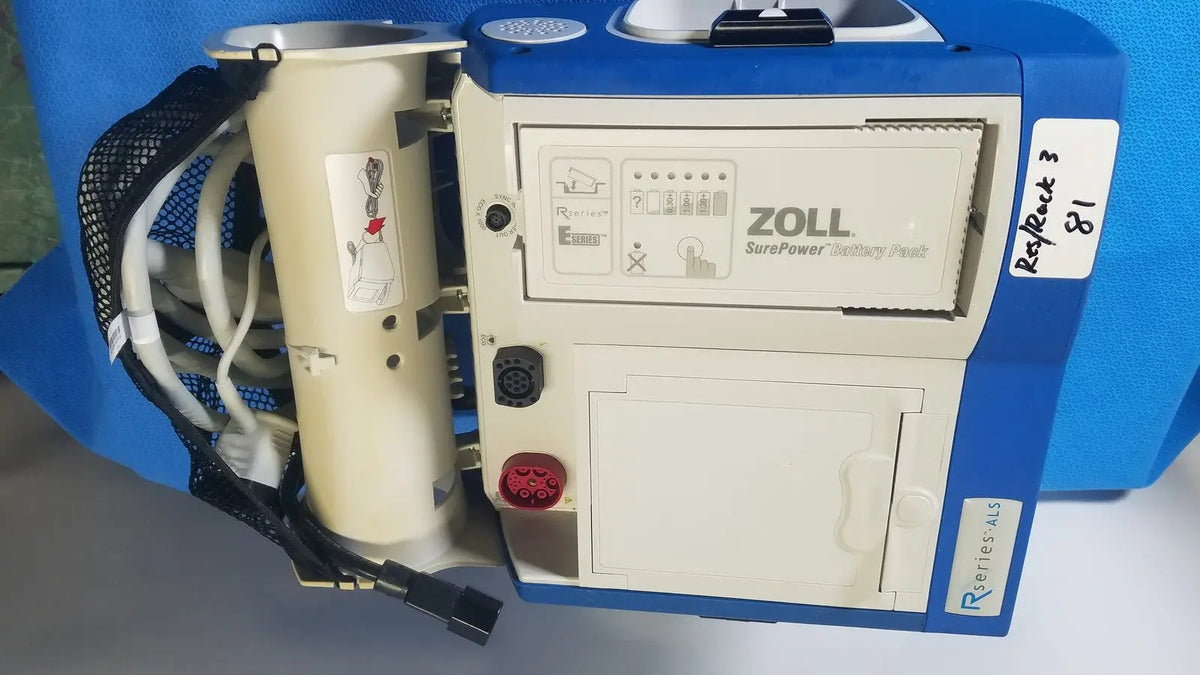 Blue and beige zoll r series als patient monitor with surepower battery pack and cylindrical battery unit attached