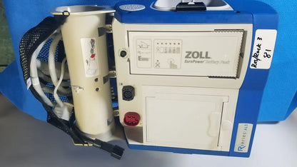 Blue and beige zoll r series als patient monitor with surepower battery pack and cylindrical battery unit attached