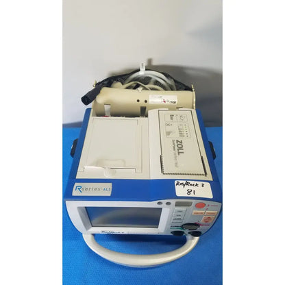 Blue and white zoll r series als patient monitor with beige handle and surepower battery pack for portability