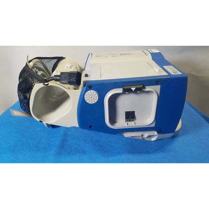 Blue and white zoll aed 3 with mesh bag attached shown with zoll r series als patient monitor and surepower battery pack