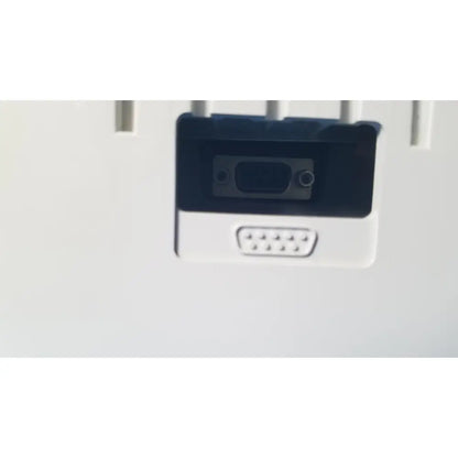 Black and white rectangular vga port adapter with two circular ports on back side of zoll surepower bay charger station ipx1